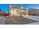 Beautiful two-story home with a well-manicured lawn, covered porch, and attached three-car garage at 12988 E 108Th Pl, Commerce City, CO 80022