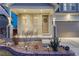 Close-up of the covered front porch with seating and landscaped yard, with a Vivint security sign at 12988 E 108Th Pl, Commerce City, CO 80022