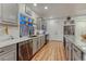 Stylish kitchen with white countertops, subway tile backsplash, and modern appliances at 12988 E 108Th Pl, Commerce City, CO 80022