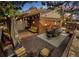 Back deck with outdoor furniture and string lights at 4180 S Yukon Way, Lakewood, CO 80235