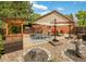 Backyard patio with a dining area, outdoor seating, and a barbeque area at 4180 S Yukon Way, Lakewood, CO 80235