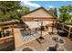 Backyard patio with a dining area, outdoor seating, and a barbeque area at 4180 S Yukon Way, Lakewood, CO 80235