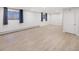 Spacious unfinished basement area with vinyl floors and natural light from the windows at 4180 S Yukon Way, Lakewood, CO 80235
