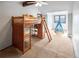 Bedroom showcasing lofted bed with study nook below, large window with lake view, and blue tent at 4180 S Yukon Way, Lakewood, CO 80235