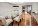 Dining room with a glass table and modern chandelier at 4180 S Yukon Way, Lakewood, CO 80235
