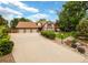 Attractive home with large driveway, beautiful landscaping and a three-car garage at 4180 S Yukon Way, Lakewood, CO 80235