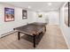Basement game room with ping pong table and finished flooring, great for entertainment at 4180 S Yukon Way, Lakewood, CO 80235