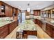 Spacious kitchen featuring granite countertops, stainless steel appliances, and ample cabinet space at 4180 S Yukon Way, Lakewood, CO 80235