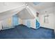 Bright bonus room features blue door and built in shelving, offering space and charm at 2514 N Humboldt St, Denver, CO 80205