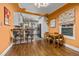 Cozy dining area with hardwood floors and bar seating overlooking the kitchen at 2514 N Humboldt St, Denver, CO 80205