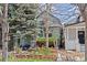 Inviting home exterior with lush garden, mature trees, and beautiful landscaping at 2514 N Humboldt St, Denver, CO 80205