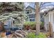 Charming home exterior with mature trees and landscaping that provides wonderful curb appeal at 2514 N Humboldt St, Denver, CO 80205