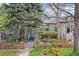 Charming home with a beautifully landscaped front yard, featuring stone accents and vibrant tulips at 2514 N Humboldt St, Denver, CO 80205