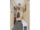 Entryway featuring wood door with glass, slate floors, white shoe bench and coat rack at 2514 N Humboldt St, Denver, CO 80205