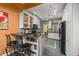 Charming kitchen featuring white cabinets, granite countertops, and mosaic backsplash at 2514 N Humboldt St, Denver, CO 80205