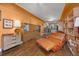 Open living room with hardwood floors, vintage furnishings, and a view of the kitchen at 2514 N Humboldt St, Denver, CO 80205