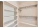 Spacious walk-in closet with ample shelving and storage, making organization effortless at 4955 N Picadilly Ct, Aurora, CO 80019