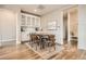 Dining room boasting hardwood floors, a built in buffet, and stylish decor at 4955 N Picadilly Ct, Aurora, CO 80019