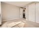 Versatile empty room featuring ample natural light and convenient closet space for any purpose at 4955 N Picadilly Ct, Aurora, CO 80019