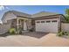 Charming home featuring stone accents, siding, and a brick driveway to the attached two car garage at 4955 N Picadilly Ct, Aurora, CO 80019