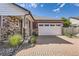 Charming home featuring stone accents, siding, and a brick driveway to the attached two car garage at 4955 N Picadilly Ct, Aurora, CO 80019