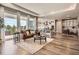 Spacious living room with hardwood floors that flows seamlessly into the dining and kitchen area at 4955 N Picadilly Ct, Aurora, CO 80019
