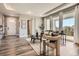 Bright living room featuring hardwood floors and large windows allowing for natural light at 4955 N Picadilly Ct, Aurora, CO 80019