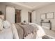 Well-appointed bedroom showcases sliding barn doors and neutral tones for a calming retreat at 4955 N Picadilly Ct, Aurora, CO 80019