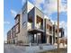 Striking exterior of modern townhouses with unique architectural details and balcony features at 2326 Eliot St # 3, Denver, CO 80211
