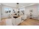 Bright living room featuring hardwood floors, stylish furniture, and an abundance of natural light at 2326 Eliot St # 3, Denver, CO 80211