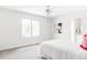 Bright bedroom with a ceiling fan, large window, and neutral decor at 5550 Preserve Dr, Greenwood Village, CO 80121