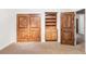 Bedroom with natural wood doors and a built-in storage niche at 5550 Preserve Dr, Greenwood Village, CO 80121