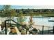 Community pool with view of neighborhood, accessible by stairs with flower boxes and black metal fencing at 5550 Preserve Dr, Greenwood Village, CO 80121