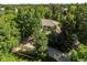 An exterior view of a home, surrounded by lush greenery at 5550 Preserve Dr, Greenwood Village, CO 80121