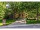 Charming home with a welcoming front entrance, featuring a long driveway at 5550 Preserve Dr, Greenwood Village, CO 80121