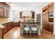 Spacious kitchen with dark wood cabinets, center island, and stainless steel appliances at 5550 Preserve Dr, Greenwood Village, CO 80121