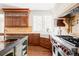 Beautiful kitchen with hardwood floors, stainless steel appliances, and ample cabinet space at 5550 Preserve Dr, Greenwood Village, CO 80121