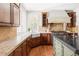 Gourmet kitchen featuring custom cabinetry, stone countertops, and high-end appliances at 5550 Preserve Dr, Greenwood Village, CO 80121