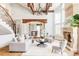 Open-concept living room featuring high ceilings, fireplace, and elegant chandelier at 5550 Preserve Dr, Greenwood Village, CO 80121