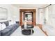 Comfortable living room features a fireplace, hardwood floors, and a decorative wood archway at 5550 Preserve Dr, Greenwood Village, CO 80121