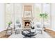 Inviting living room with fireplace, large windows and comfortable seating area at 5550 Preserve Dr, Greenwood Village, CO 80121