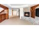 Finished basement with a stone fireplace and a flatscreen TV at 5550 Preserve Dr, Greenwood Village, CO 80121