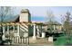 Community pavilion with stone columns and pergola, featuring outdoor grill and seating area at 5550 Preserve Dr, Greenwood Village, CO 80121