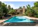 Beautiful pool area with a large in-ground pool and an elegant outdoor lounge space at 5550 Preserve Dr, Greenwood Village, CO 80121
