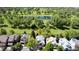 Aerial view of a home near a beautiful pond and lush green golf course at 14186 E Hampden Pl, Aurora, CO 80014