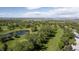 Scenic aerial view of golf course and surrounding landscape, showcasing proximity to recreational amenities at 14186 E Hampden Pl, Aurora, CO 80014