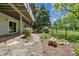 Walk out basement with an open lawn and a small rock garden at 14186 E Hampden Pl, Aurora, CO 80014