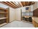 Unfinished basement area with open ceiling, storage, and workbench space; great for customizing at 14186 E Hampden Pl, Aurora, CO 80014