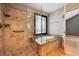 Luxurious bathroom featuring walk-in shower and soaking tub at 14186 E Hampden Pl, Aurora, CO 80014