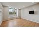 Bright bedroom features hardwood floors, large window, and recessed lighting at 14186 E Hampden Pl, Aurora, CO 80014
